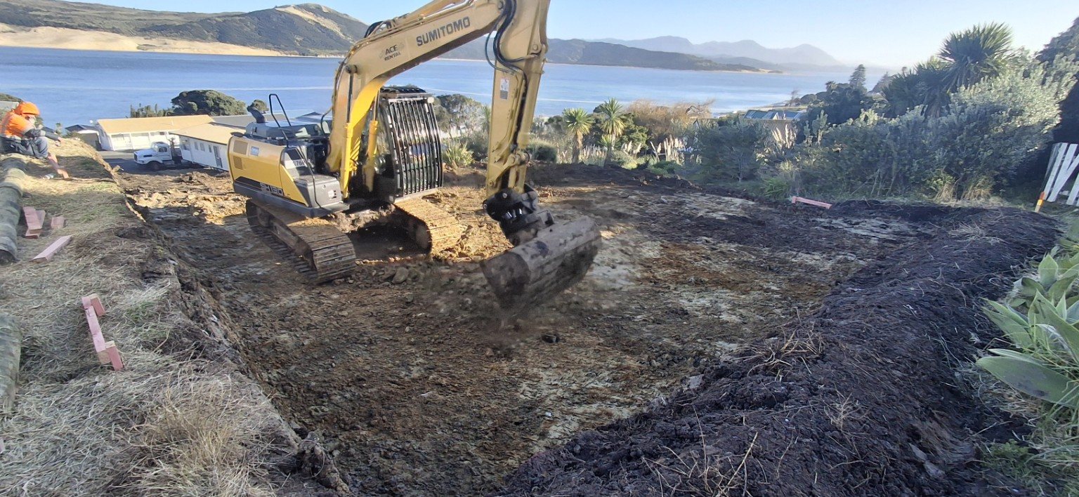 Excavator cutting a house pad